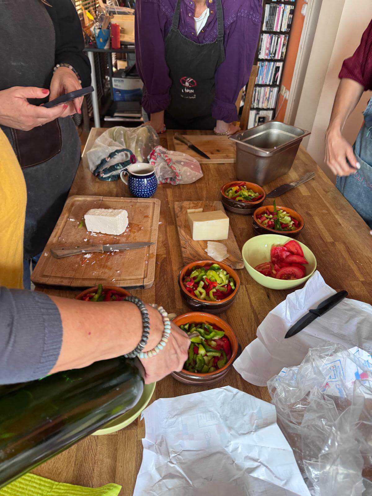 Students cooking traditional Greek dishes during intensive Greek week in Athens